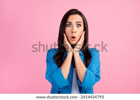 Portrait of speechless woman with long hairstyle wear stylish shirt hold arms on cheekbones staring isolated on pink color background