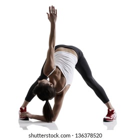 Portrait Of Sport Girl Doing Yoga Stretching Exercise, Studio Shot In Silhouette Technique Over White Background