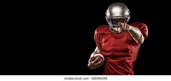 Portrait sports player in red jersey pointing against black - Powered by Shutterstock