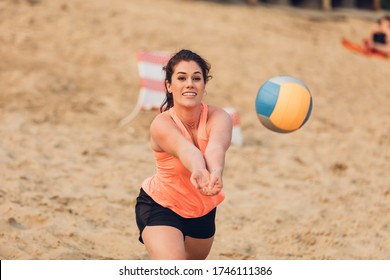 Portrait of a sportswoman playing beach volleyball