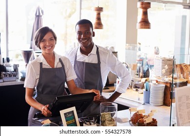 Portrait Of Staff Working At Delicatessen Checkout