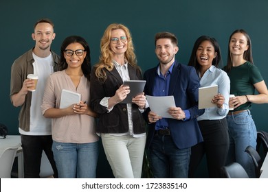 Portrait Of Standing In Row Smiling Team Looking At Camera. Happy Diverse Corporate Staff, Young And Older Specialists, Company Representatives, Bank Workers Photo Shoot, HR Agency Recruitments.