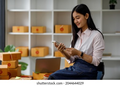 Portrait Of Starting Small Businesses SME Owners Female Entrepreneurs Working On Receipt Box And Check Online Orders To Prepare To Pack The Boxes, Sell To Customers, Sme Business Ideas Online.