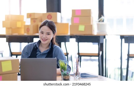 Portrait Of Starting Small Businesses SME Owners Asian Woman Check Online Orders Selling Products Online And Working With Boxs Freelance Work At Home Asian Sme Business Online Small Medium Enterprise
