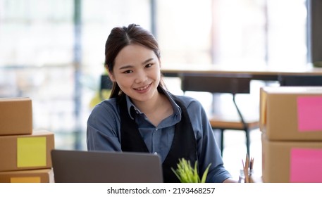 Portrait Of Starting Small Businesses SME Owners Asian Woman Check Online Orders Selling Products Online And Working With Boxs Freelance Work At Home Asian Sme Business Online Small Medium Enterprise
