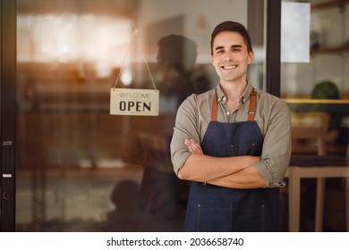 Portrait of Startup successful small business owner in coffee shop.handsome man barista cafe owner. SME entrepreneur seller business concept.