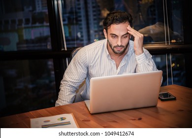 Portrait Of Stress Sad Business Man Working Late At Night Time In Office. Business Man Work Hard Lifestyle Stress Burnout Overtime Office Syndrome, Work From Home, Quarantine Coronavirus Concept.