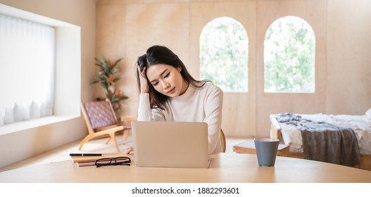 Portrait of stress sad business woman working alone at home office. Business woman work hard lifestyle stress burnout overtime office syndrome, work from home, quarantine coronavirus concept. - Shutterstock ID 1882293601