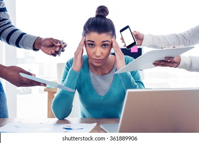 Portrait of stressed businesswoman sitting in creative office - Powered by Shutterstock