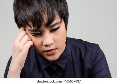 Portrait of stressed young transgender person