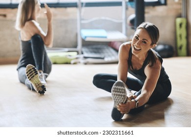 Portrait, stretching and women training, balance and workout for stress relief, wellness and healthy lifestyle. Face, female people and athletes on the floor, stretch legs and practice with progress - Powered by Shutterstock