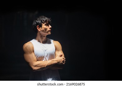 Portrait of Strong Asian sportsman athlete in sportswear do sport training workout bodybuilding exercise in abandoned building. Shirtless man bodybuilder practicing muscular build in dark place gym - Powered by Shutterstock