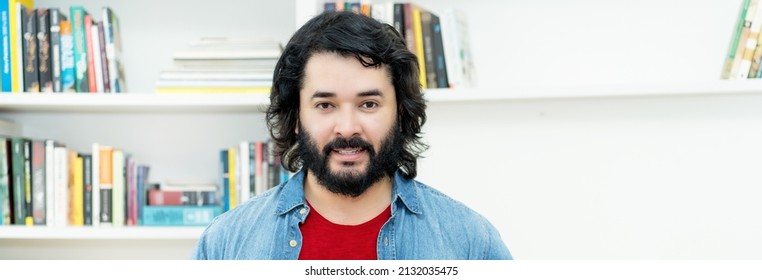 Portrait of strong man with full beard indoors at home