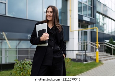 Portrait Of A Strong Successful Female Leader Against The Backdrop Of A Modern Office