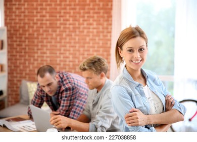 Portrait Of Student Girl At Home With Roommates