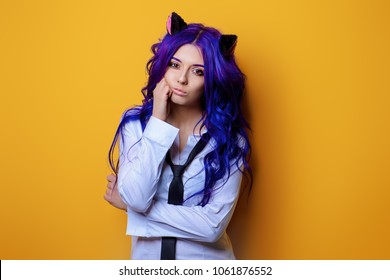 Portrait of a student girl with purple hair and cat's ears posing at studio. Japanese style anime. 