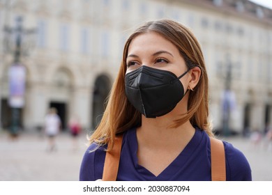 Portrait Of Student Girl Wearing A Protective KN95 FFP2 Black Mask Walking In City Street