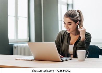 Portrait Of Student Girl Working On Laptop.