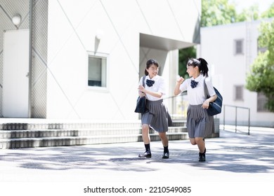 Portrait Of A Students Running Outside