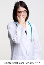 Portrait Studio Isolated Cutout Closeup Shot Of Asian Professional Successful Female Doctor In Lab Coat With Stethoscope Smiling Look At Camera Holding Hand Adjusting Eyeglasses On White Background.