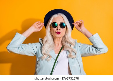 Portrait of stunning charming old lady touch her retro hat enjoy valentine day date send air kiss wear good look clothes isolated over bright color background