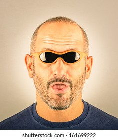 Portrait Of A Stupid Man With Too Small Sunglasses