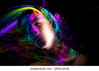 Portrait in the style of light painting. Long exposure photo, abstract portrait , psychedelic poster