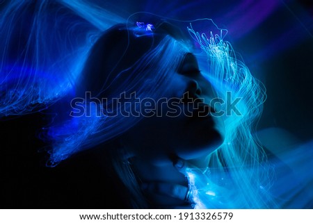 Similar – Young woman dancing and listening to music