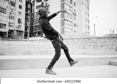 Portrait Of Stylish African American Man On Sportswear, Cap And Glasses. Black Men Model Street Fashion, Dancing Hip Hop.