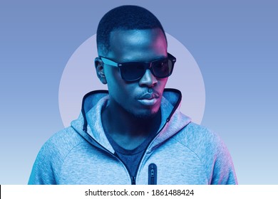 Portrait stylish black man  wearing hoodie   sunglasses