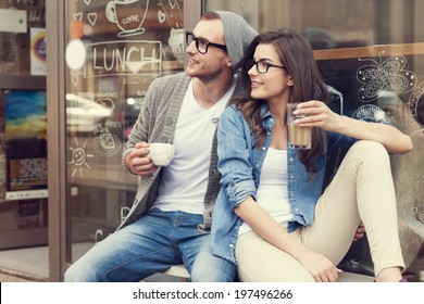 Portrait of stylish couple at outside of cafe  - Powered by Shutterstock