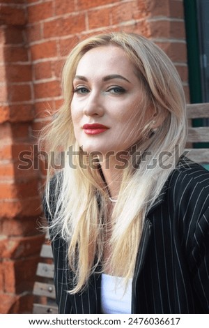 Similar – Image, Stock Photo contemplative young woman in winter jacket