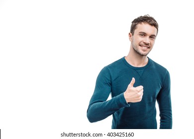 Portrait Of Stylish Handsome Young Man Isolated On White Background. Man Smiling, Showing Thumb Up And Looking At Camera. Free Space For Logo