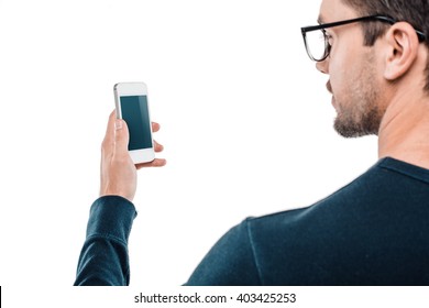 Portrait Of Stylish Handsome Young Man Isolated On White Background. Man Wearing Glasses And Using Mobile Phone. Back View Photo