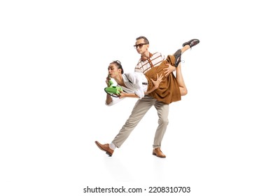 Portrait Of Stylish Man Holding Woman In Retro Clothes Talking On Vintage Phone Isolated Over White Studio Background. Concept Of Business, Office Lifestyle, Success, Ballet, Career, Expression, Ad