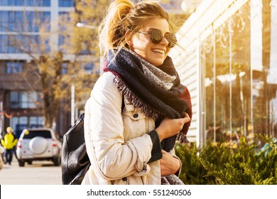 Portrait Of Stylish Pretty Woman Near Coffee On The Street.Shine Sun Light,early Spring,warm Winter Time.Dark Glasses