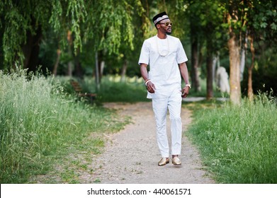 Portrait Of Stylish And Rich Black African American Man On White Clothes, Sunglasses And Hat 