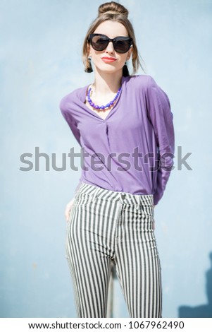 Similar – young beautiful lady posing in the living room next to a window