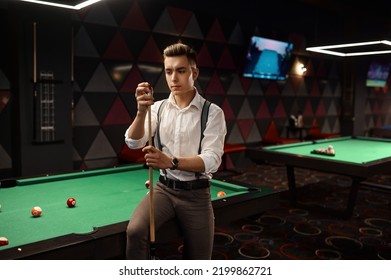 Portrait of stylish young pool player - Powered by Shutterstock