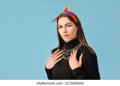 Portrait of stylish young transgender woman on color background - Powered by Shutterstock