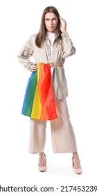 Portrait Of Stylish Young Transgender Woman With LGBT Flag On White Background