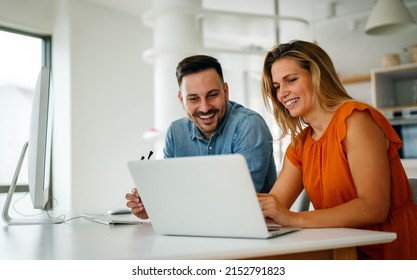 Portrait of success business people working together in home office. Couple teamwork startup concept - Shutterstock ID 2152791823