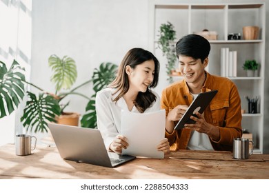 Portrait of success business people working together in home office. Couple teamwork startup concept

 - Powered by Shutterstock