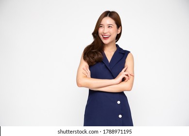 Portrait of successful business asian women in blue dress with arms crossed and smile isolated over white background