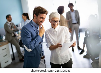 Portrait of successful business people working together in corporate office. - Shutterstock ID 2189325963