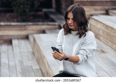 Portrait Of A Successful Business Woman Using IPhone 