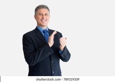 Portrait Of Successful Businessman Clapping Hands