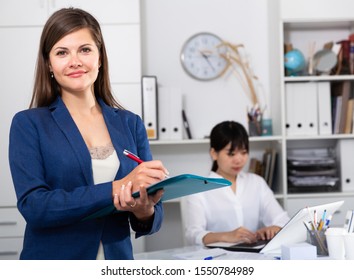 Portrait of successful confident business woman in office interior