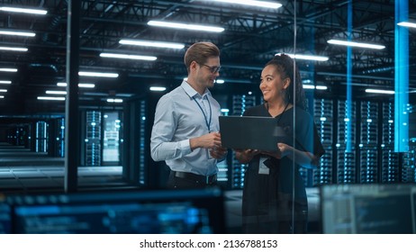 Portrait of Successful Corporate CEO and Investment Manager Talking, Using Laptop Computer while Standing in City Office. Stock Market Businesspeople Negotiate e-Commerce Software Purchase - Shutterstock ID 2136788153