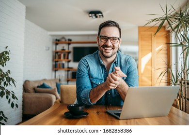 Portrait of a successful entrepreneur at cozy home office, smiling at camera. - Powered by Shutterstock